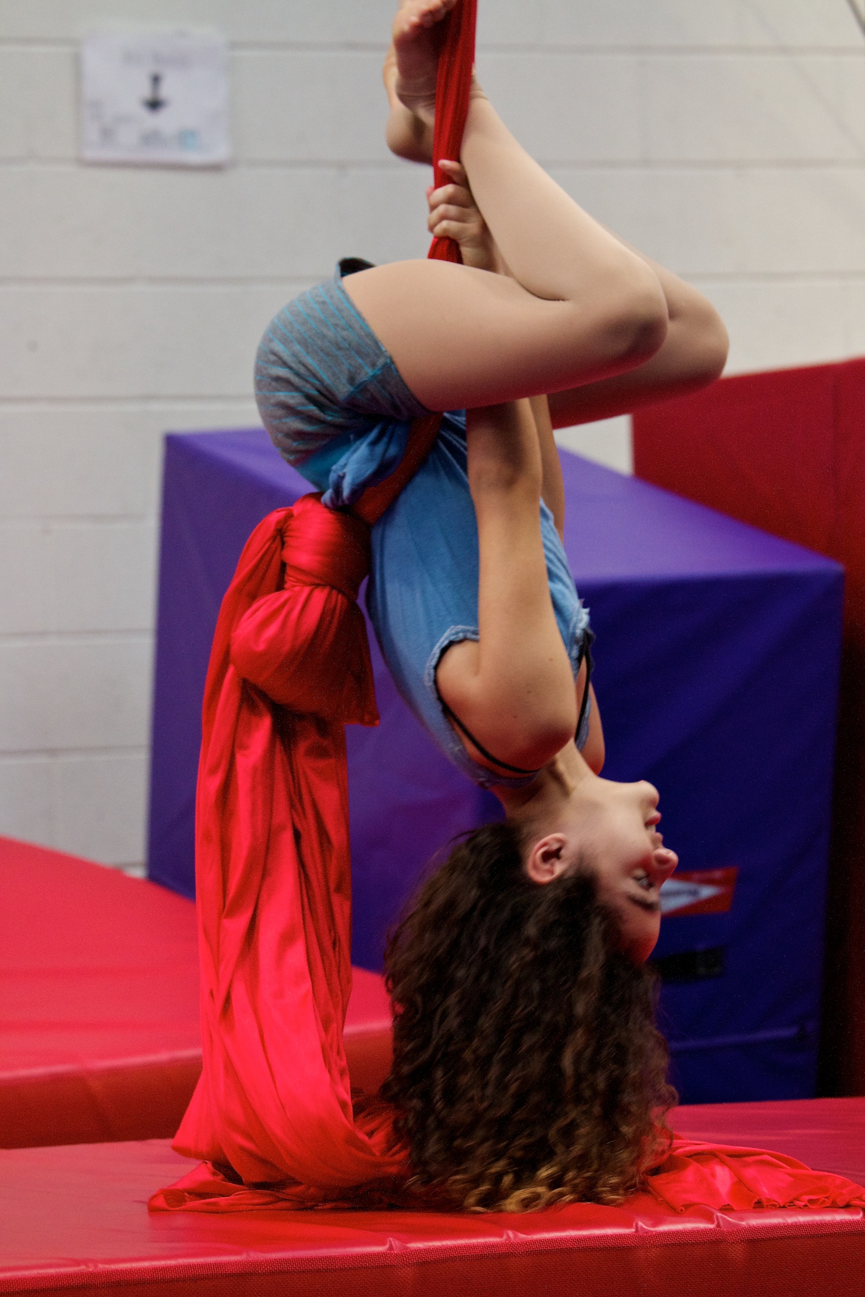 Girl upside down on aerial tissu